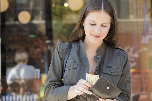 woman wallet checking